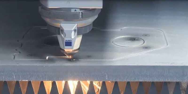 laser cutter cutting steel part
